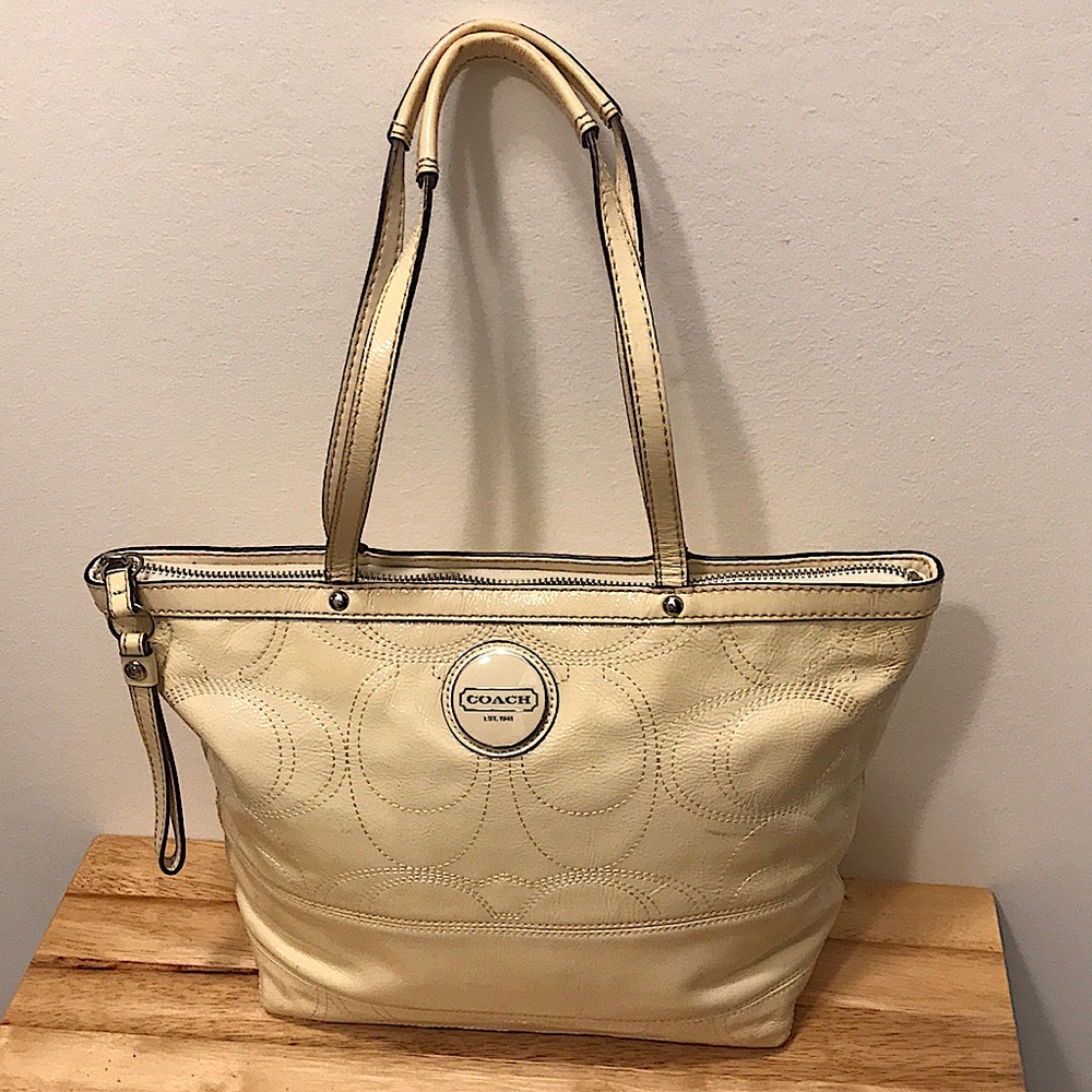 Handcrafted full-grain cowhide leather Coach ivory purse